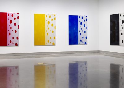 A series of artworks on a gallery wall