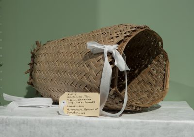 A woven fishing basket on a collection table