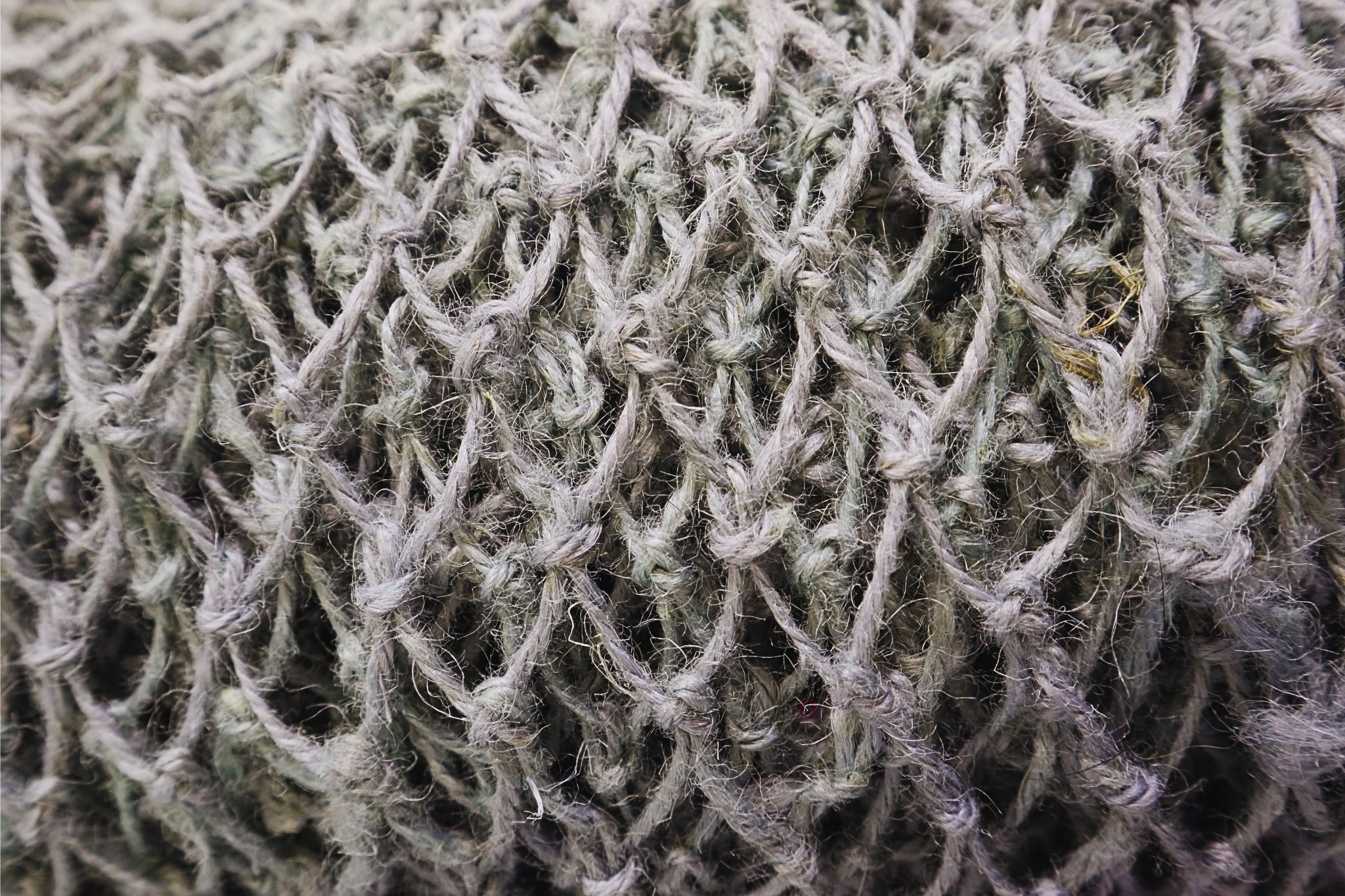 Untitled design A close up photograph of a handwoven jute net